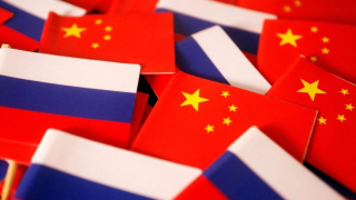 FILE PHOTO: Flags of China and Russia are displayed in this illustration picture taken March 24, 2022. REUTERS/Florence Lo/Illustration
