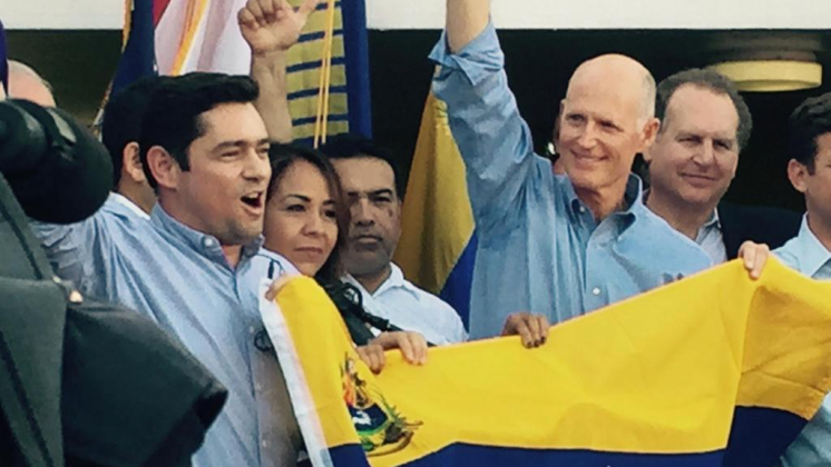 Rick Scott, Carlos Vecchio
